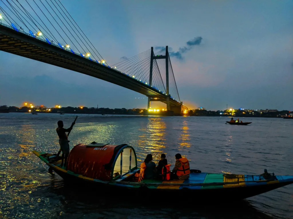 Evening view of Vidyasagar Setu over the Hooghly River, a popular West Bengal tourist destination in Kolkata.